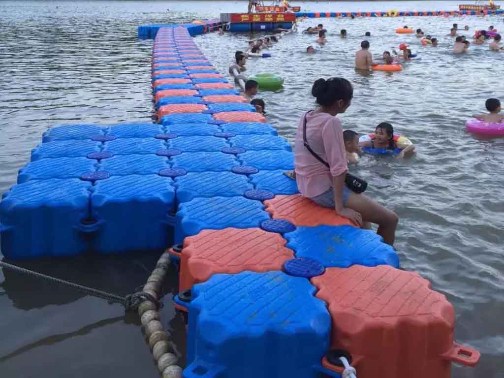 ada-public-swim-platform-wheelchair-ramp ADA-compliant lake swimming platform with access ramp for public parks