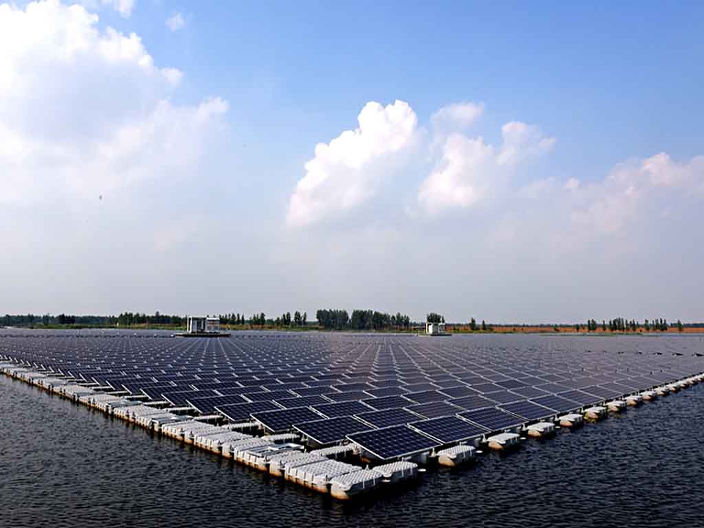drone-robotic-solar-panel-cleaning Autonomous cleaning robot maintaining floating solar panels, reducing water usage by 90% compared to manual methods