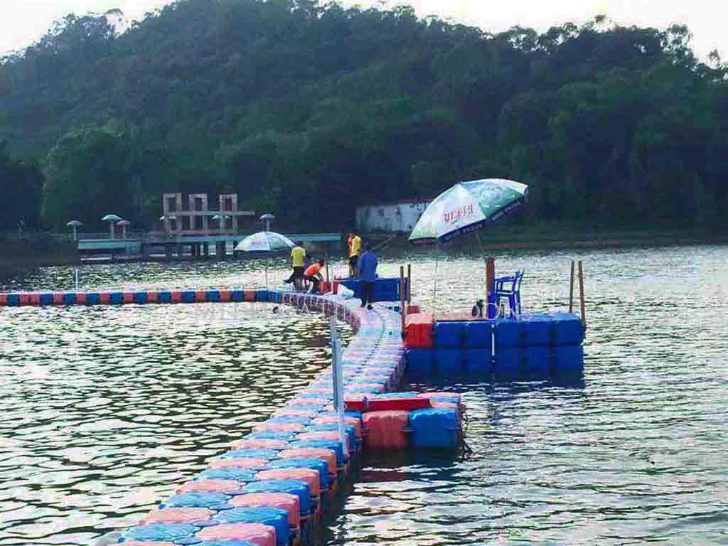 multi-level-swim-platform-family-lake Three-tier floating swim platform with diving board, safety rails, and UV-resistant deck supporting 20 people at residential lake