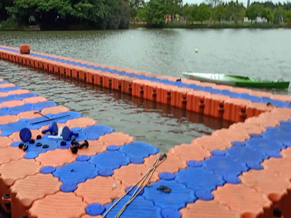 residential-lake-kayak-dock-installation Floating kayak dock installed on residential lake with foldable access ramp