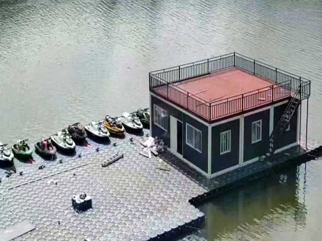 Completed modern HDPE residential floating dock on a lake, featuring a lounge area and integrated jet ski dock port