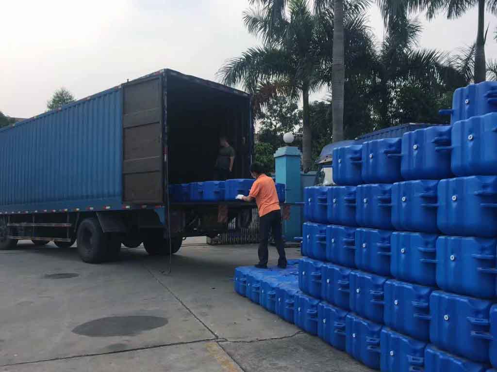 UV-stabilized HDPE floating dock modules with anti-algae surface in marine environment, rated for 20-year saltwater durability per ASTM D1435
