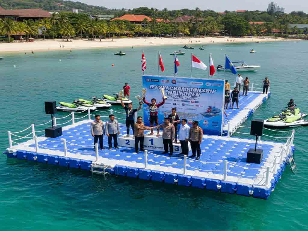 Jet ski champions receiving trophies on modular floating award platform with LED podium and safety railings