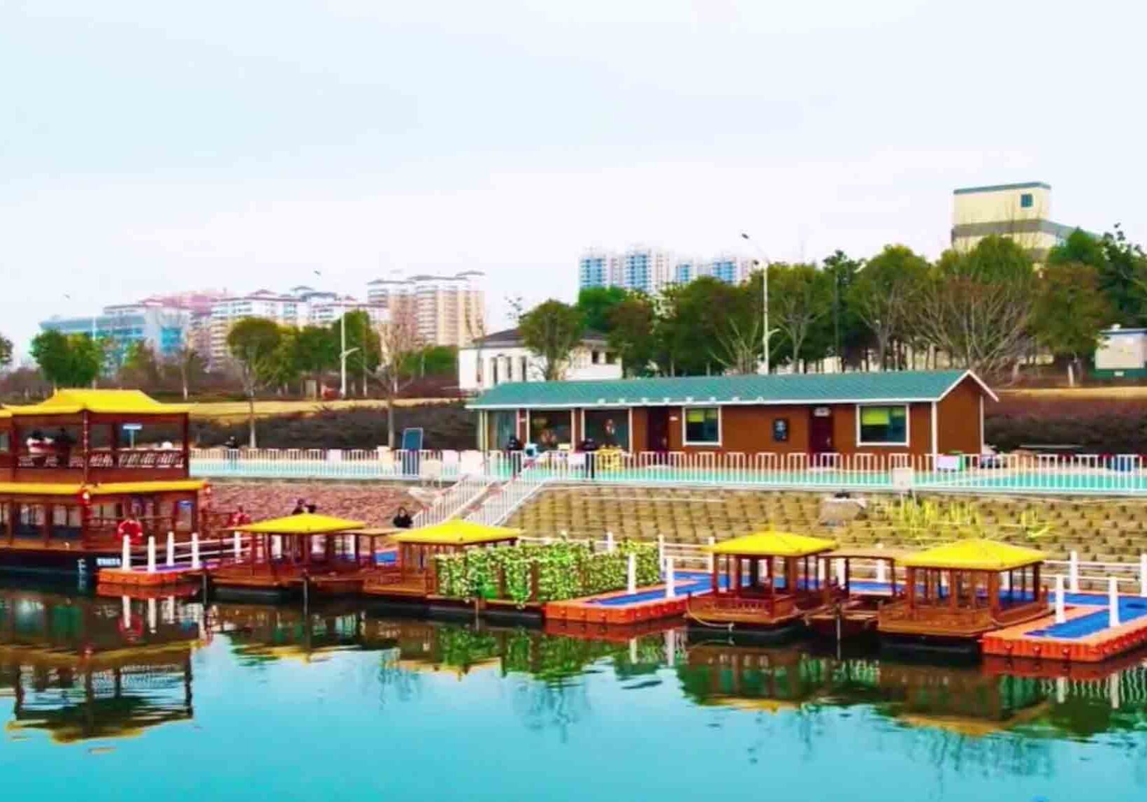 Custom-built residential floating dock with teak decking and stainless steel accessories at luxury waterfront estate