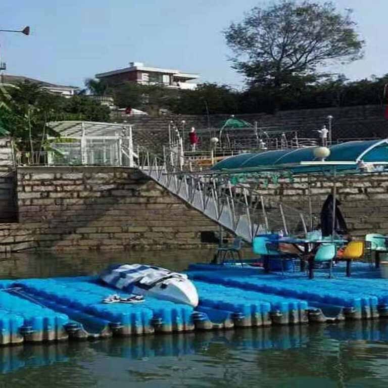 Swift-water rescue PWC docking station with quick-launch ramps and emergency lighting